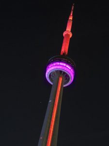CN Tower lit up red and purple